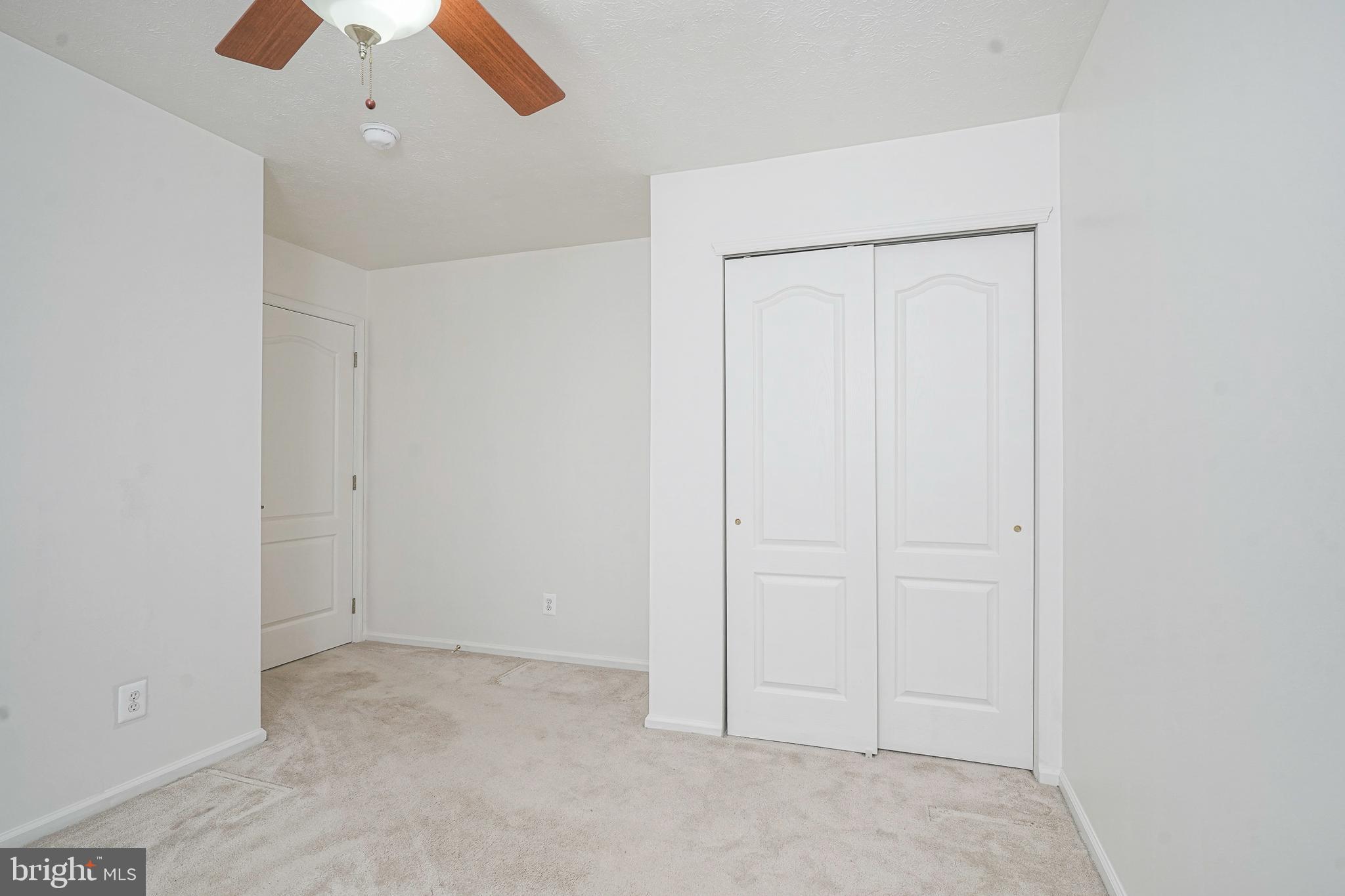 16 Magnolia Lane Sewell, NJ 08080 - Photo 9 of 21 an empty room with a ceiling fan