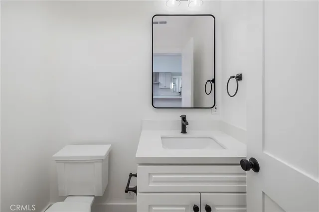 a bathroom with a toilet and a sink