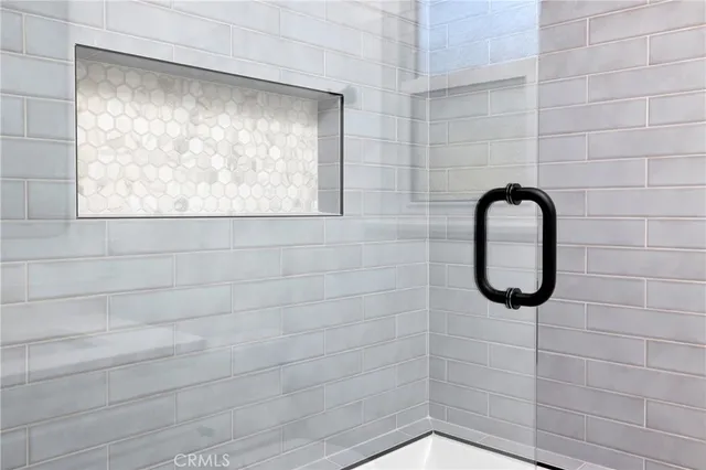 a bathroom with a shower and a window