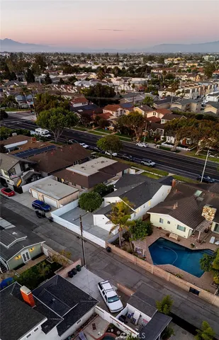 an aerial view of residential houses with city view