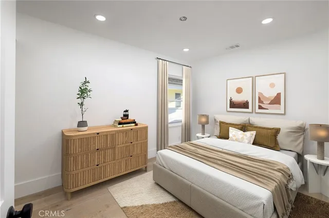 a bedroom with bed and window