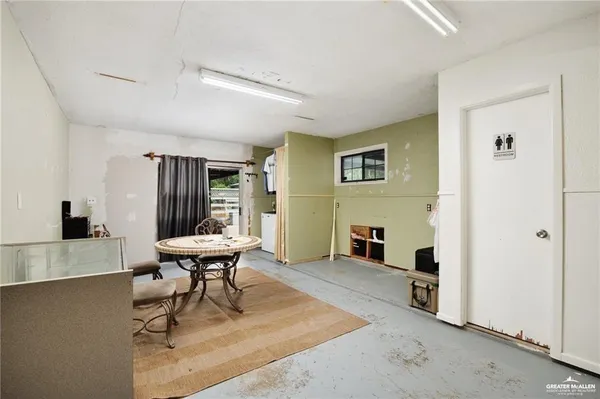 a living room with furniture and a table