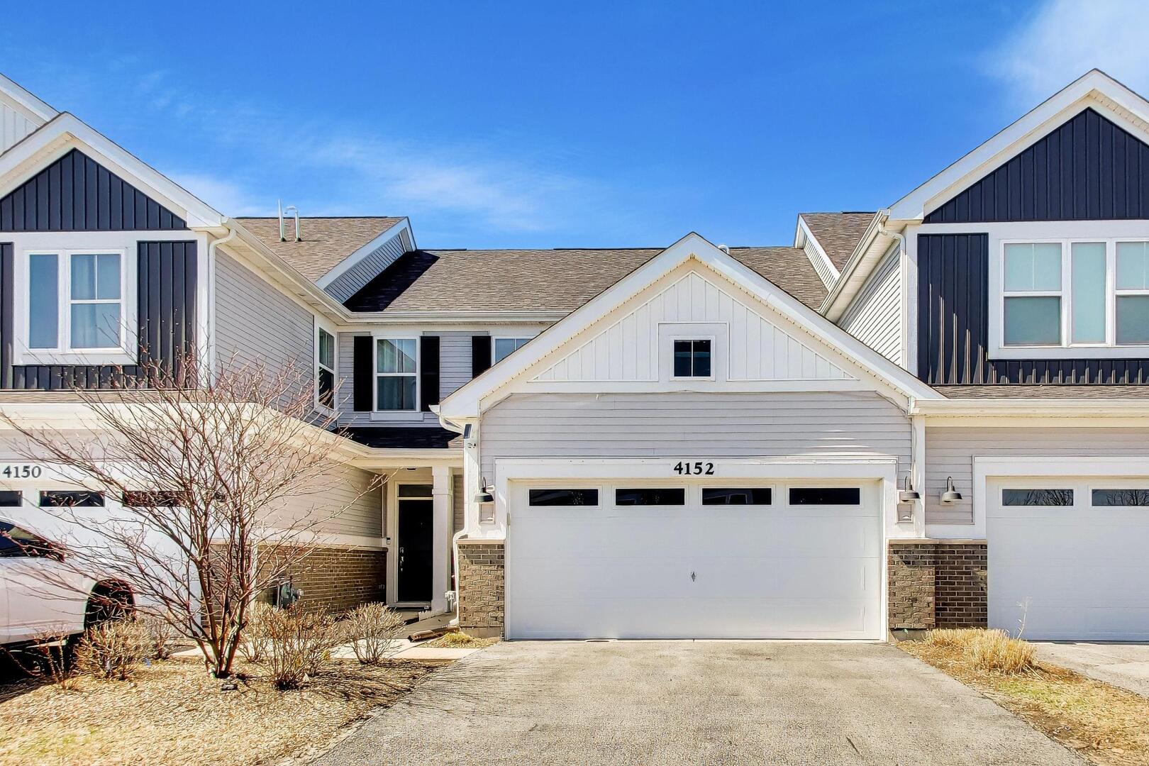 4152 Calder Lane Aurora, IL 60504 - Photo 1 of 30 a front view of a house with a yard