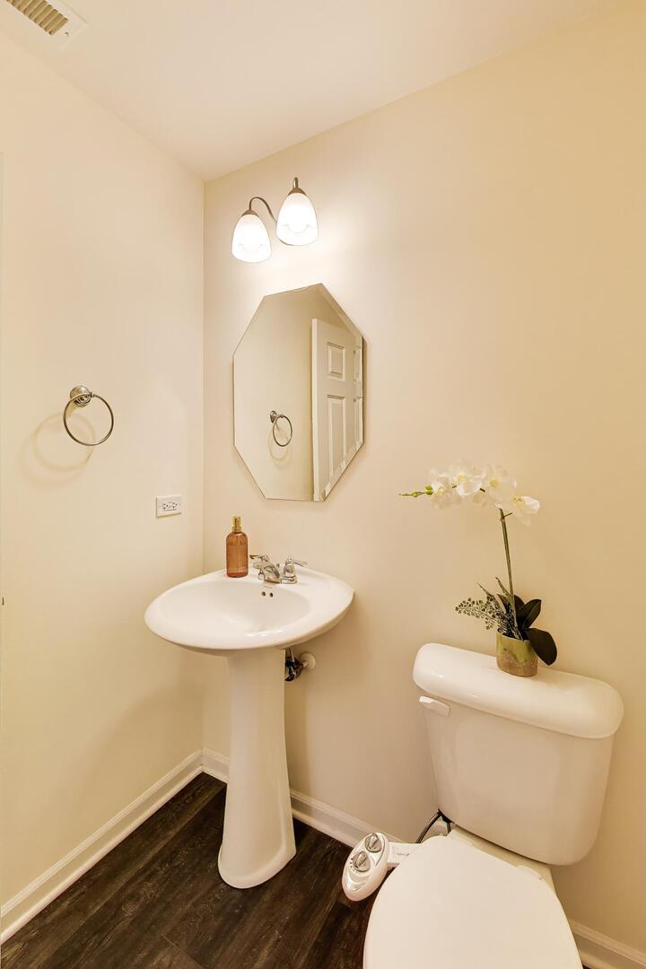 4152 Calder Lane Aurora, IL 60504 - Photo 12 of 30 a bathroom with a toilet sink and mirror