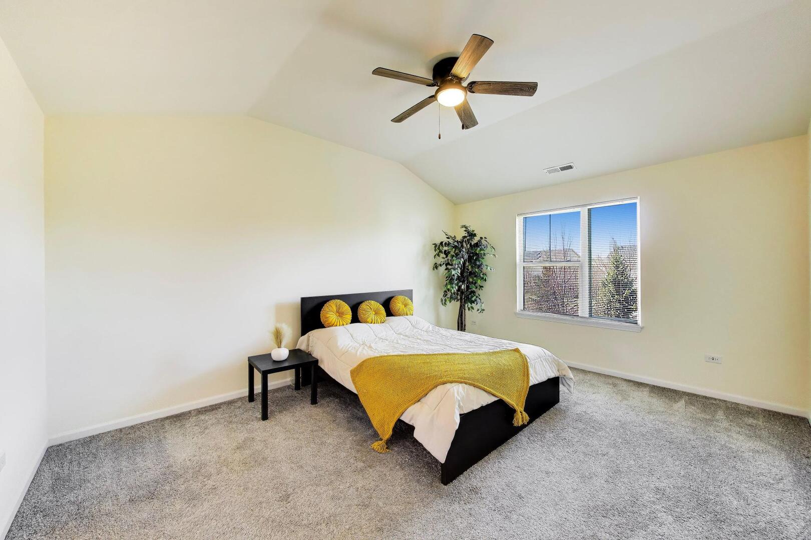 4152 Calder Lane Aurora, IL 60504 - Photo 13 of 30 a bed sitting in a room next to a window