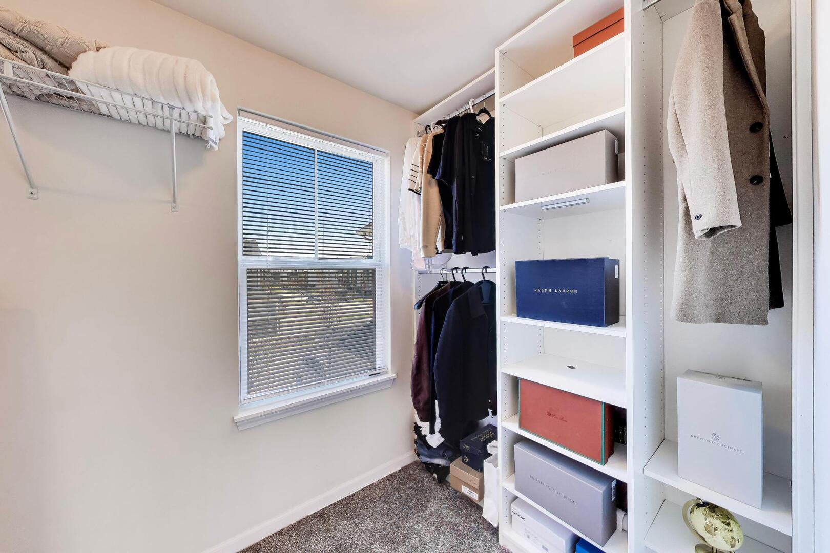 4152 Calder Lane Aurora, IL 60504 - Photo 18 of 30 a view of walk in closet with clothes and shoes