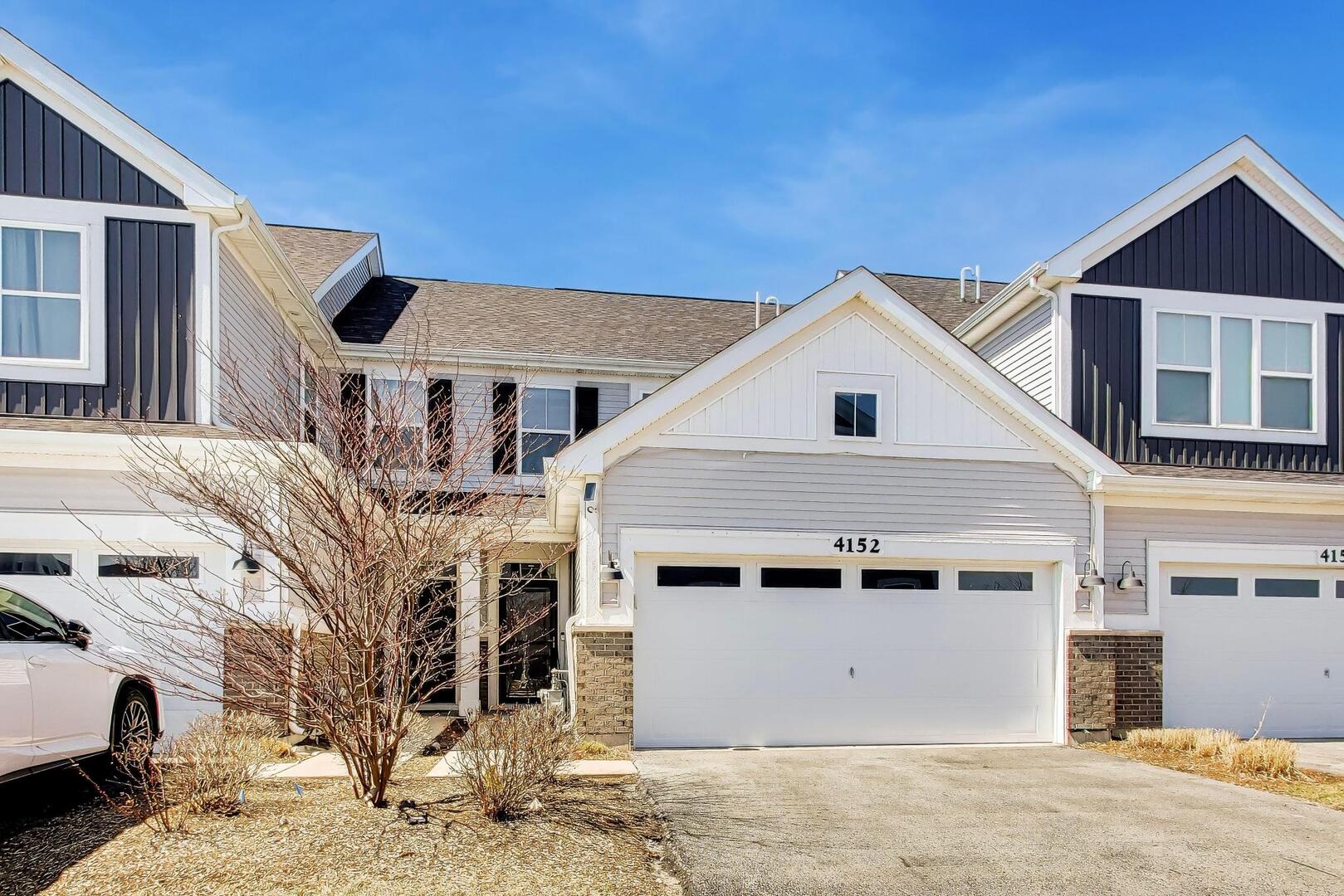 4152 Calder Lane Aurora, IL 60504 - Photo 2 of 30 a view of a big house with wooden fence