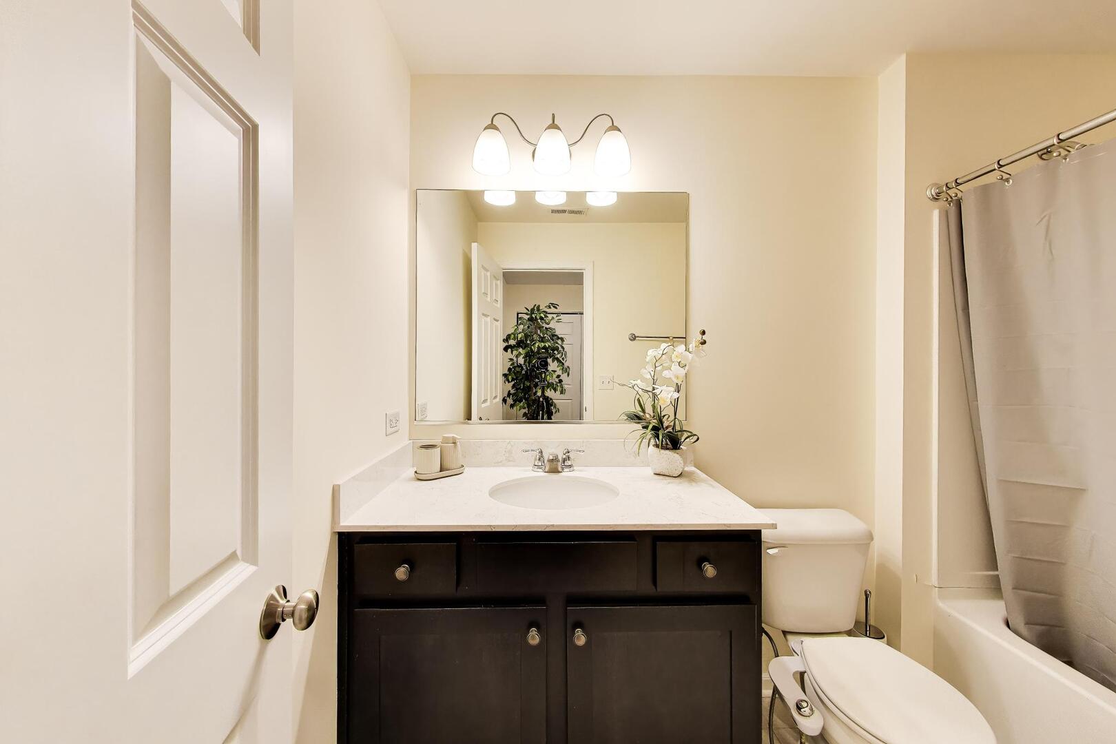 4152 Calder Lane Aurora, IL 60504 - Photo 22 of 30 a bathroom with a sink vanity mirror and toilet
