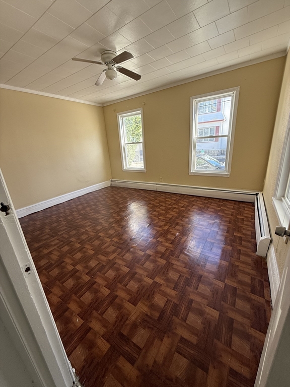 213 Concord Street, Unit 1 Lowell, MA 01852 - Photo 12 of 12 a view of an empty room with a window