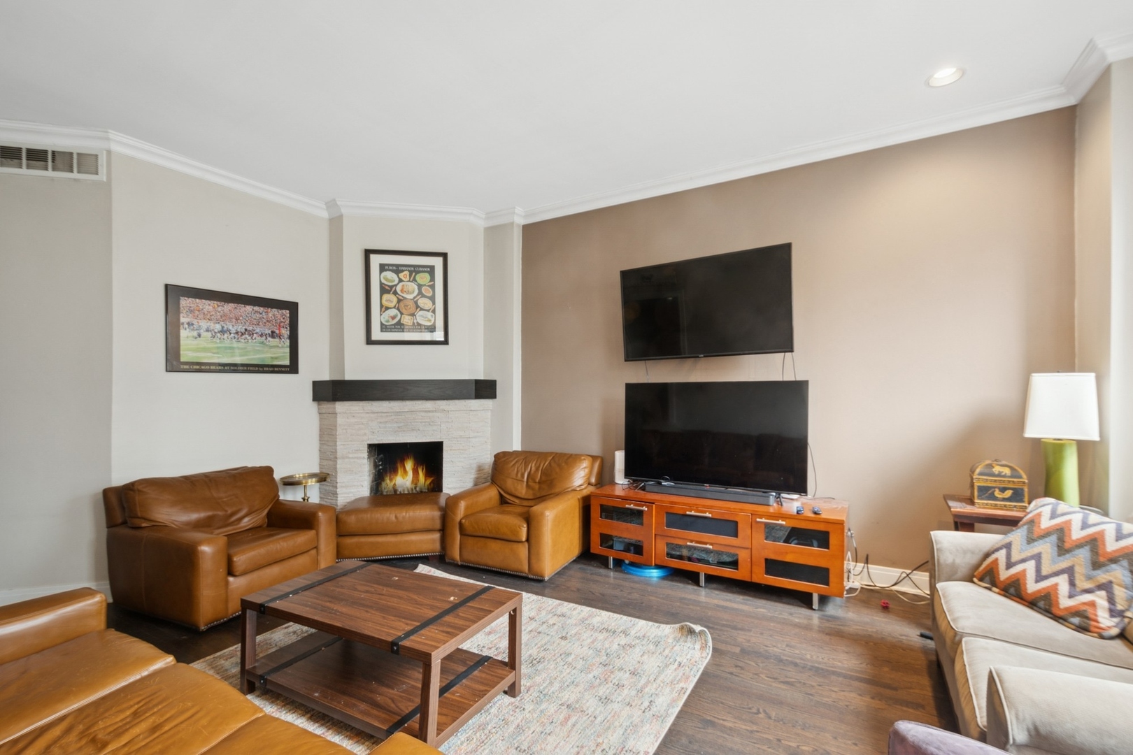 1302 North Cleveland Avenue, Unit 2 Chicago, IL 60610 - Photo 3 of 12 a living room with furniture and a flat screen tv
