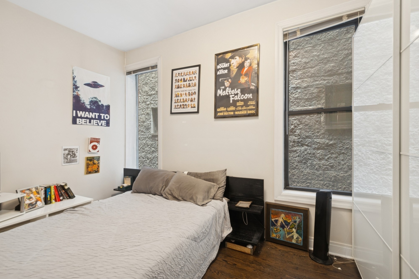 1302 North Cleveland Avenue, Unit 2 Chicago, IL 60610 - Photo 8 of 12 a bedroom with a bed and a table in it