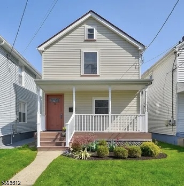 443 Downer Street Westfield, NJ 07090 - Photo 1 of 18 a front view of a house with a yard