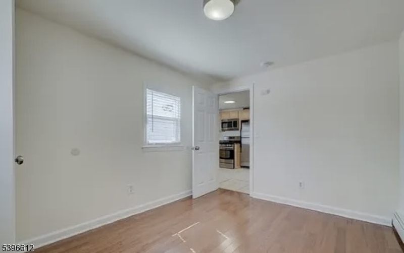 443 Downer Street Westfield, NJ 07090 - Photo 12 of 18 wooden floor in an empty room