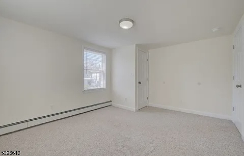 443 Downer Street Westfield, NJ 07090 - Photo 15 of 18 an empty room with a window