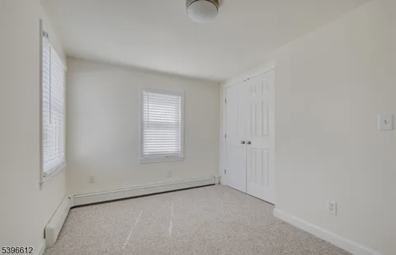 443 Downer Street Westfield, NJ 07090 - Photo 18 of 18 a view of an empty room with a window