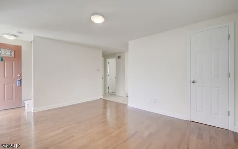 443 Downer Street Westfield, NJ 07090 - Photo 4 of 18 a view of an empty room with wooden floor