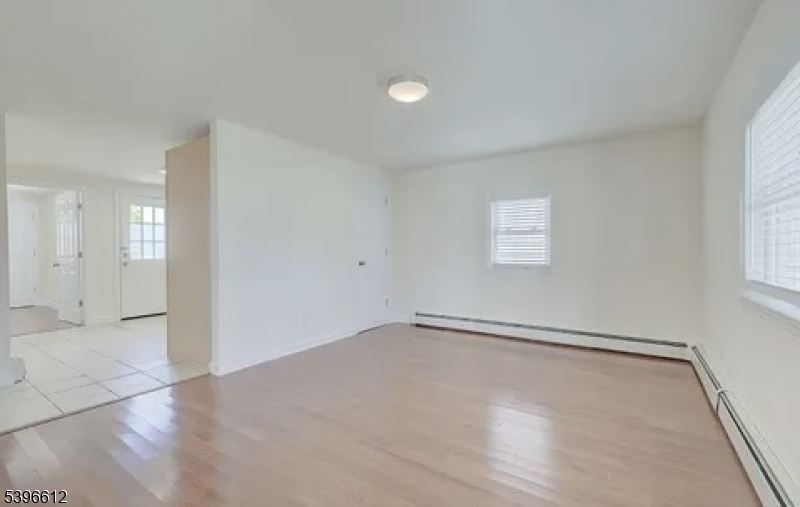 443 Downer Street Westfield, NJ 07090 - Photo 5 of 18 an empty room with windows