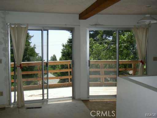 26600 Valley View Lake Rimforest, CA 92378 - Photo 2 of 5 a view of a glass door with a balcony from a room