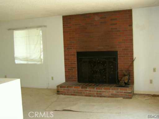 26600 Valley View Lake Rimforest, CA 92378 - Photo 4 of 5 a building with a fireplace
