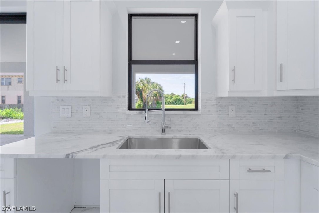 3915 20th Street Southwest Lehigh Acres, FL 33976 - Photo 11 of 50 a bathroom with a sink and a vanity