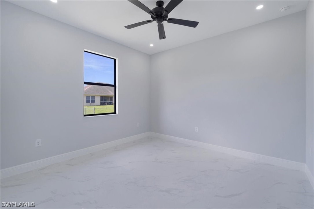 3915 20th Street Southwest Lehigh Acres, FL 33976 - Photo 19 of 50 a view of an empty room with a window
