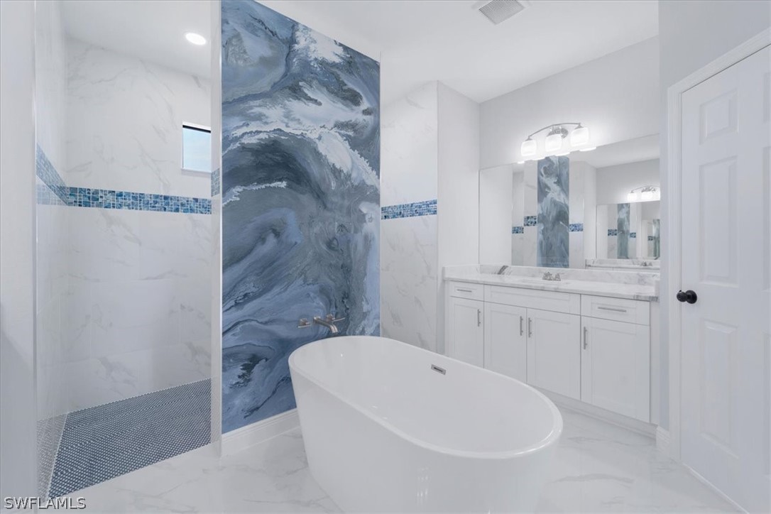 3915 20th Street Southwest Lehigh Acres, FL 33976 - Photo 28 of 50 a bathroom with a sink a toilet and shower