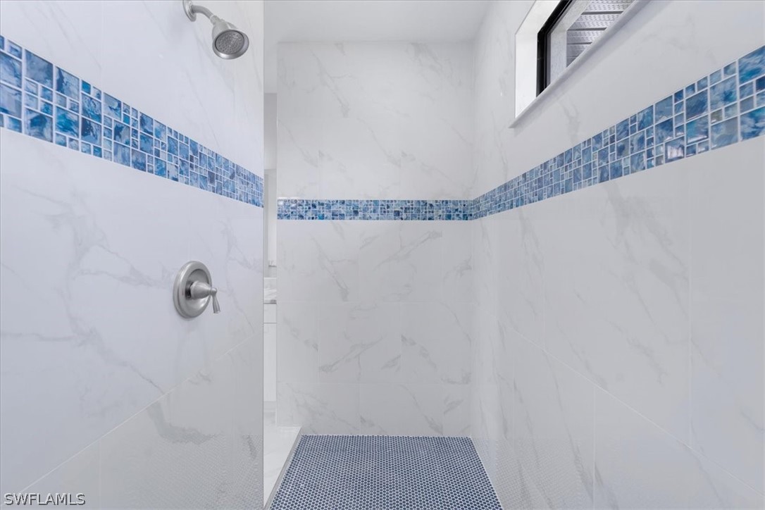 3915 20th Street Southwest Lehigh Acres, FL 33976 - Photo 30 of 50 a bathroom with a shower