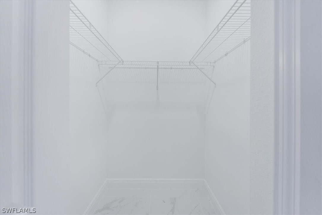 3915 20th Street Southwest Lehigh Acres, FL 33976 - Photo 33 of 50 a view of a rack on the wall