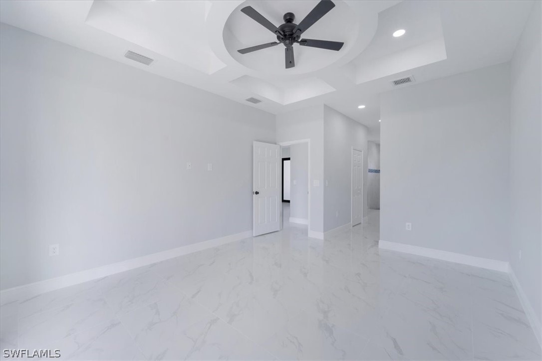 3915 20th Street Southwest Lehigh Acres, FL 33976 - Photo 35 of 50 a view of a livingroom with a ceiling fan & window
