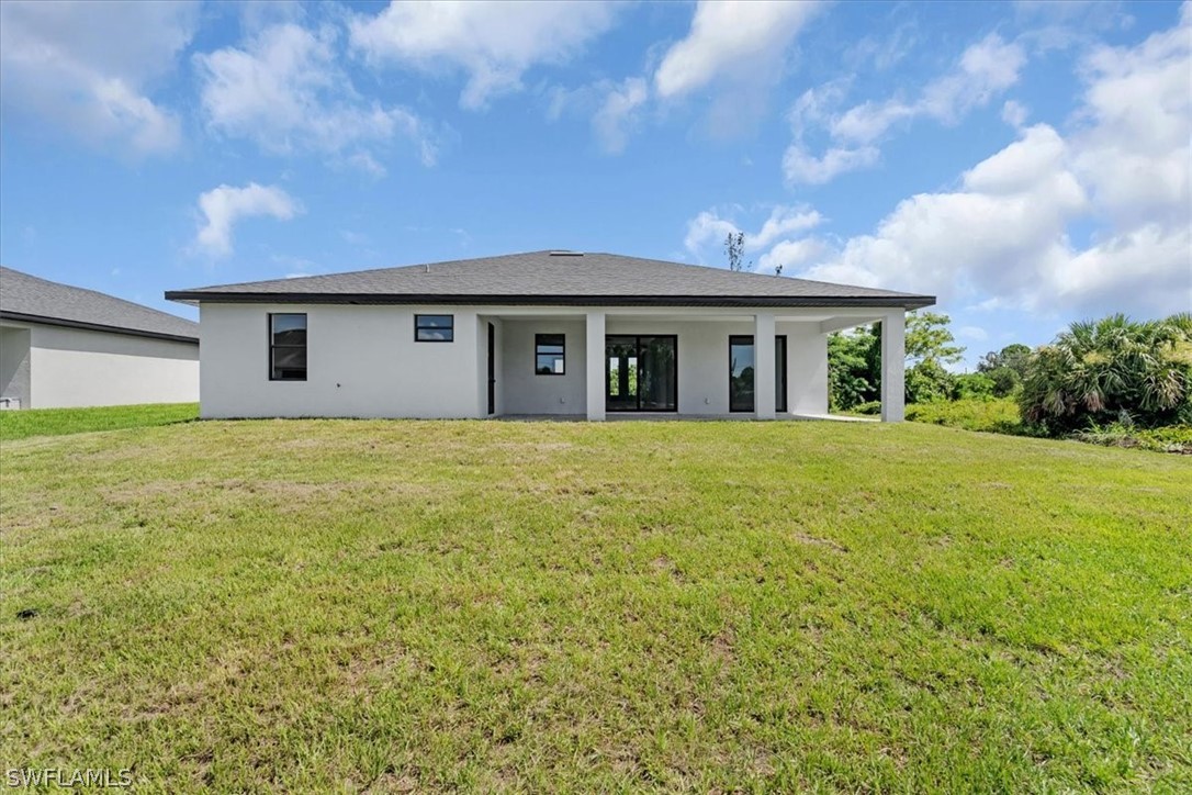 3915 20th Street Southwest Lehigh Acres, FL 33976 - Photo 40 of 50 a house view with a garden space