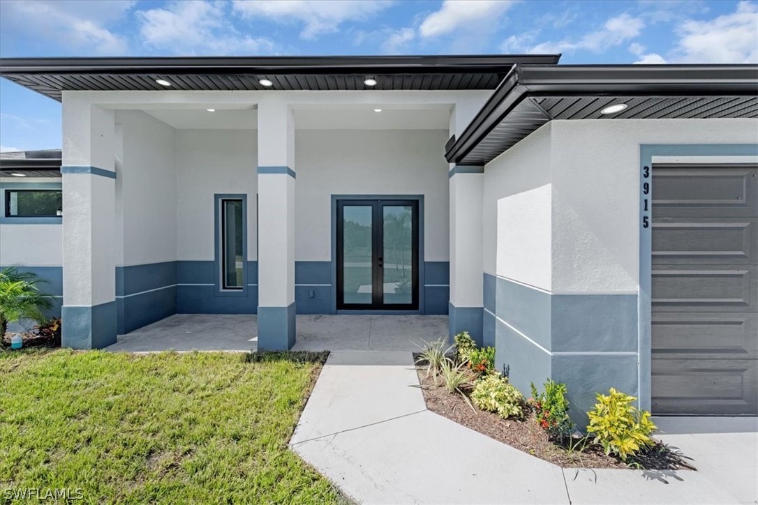 3915 20th Street Southwest Lehigh Acres, FL 33976 - Photo 4 of 50 a front view of a house