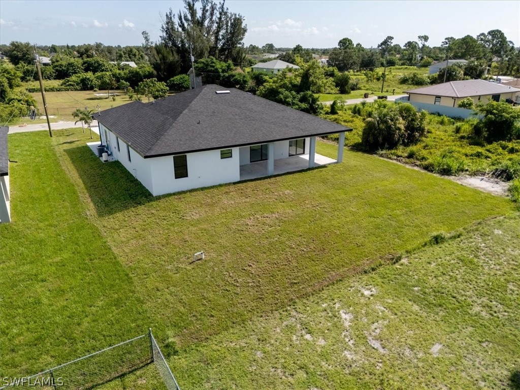 3915 20th Street Southwest Lehigh Acres, FL 33976 - Photo 44 of 50 a house view with a garden space