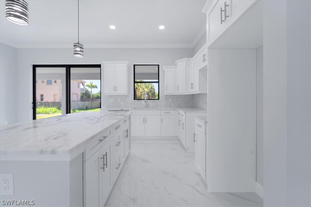 3915 20th Street Southwest Lehigh Acres, FL 33976 - Photo 10 of 50 a bathroom with a granite countertop sink a vanity and a large mirror