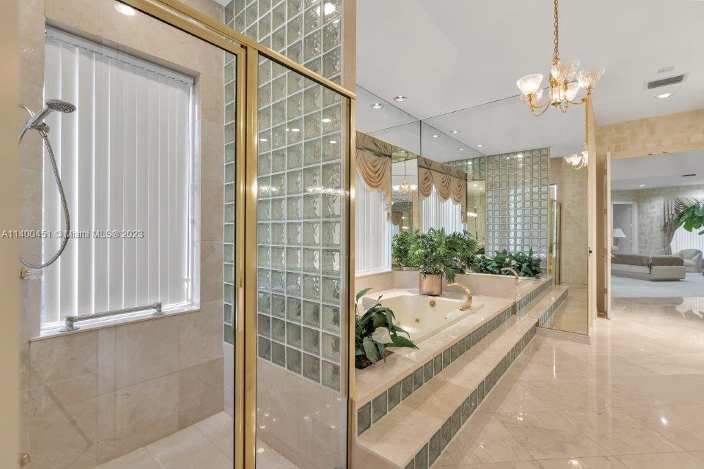 7236 Queenferry Circle Boca Raton, FL 33496 - Photo 12 of 31 a bathroom with a tub and shower