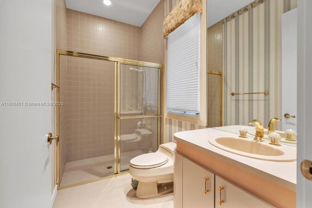 7236 Queenferry Circle Boca Raton, FL 33496 - Photo 16 of 31 a bathroom with a sink toilet and shower