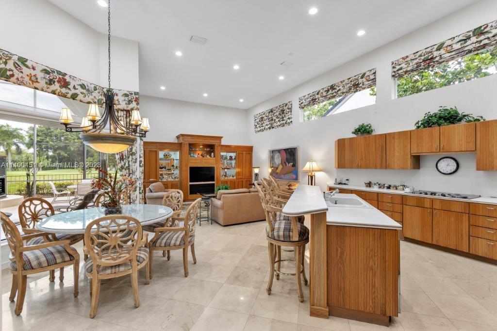 7236 Queenferry Circle Boca Raton, FL 33496 - Photo 21 of 31 a large kitchen with a table and chairs