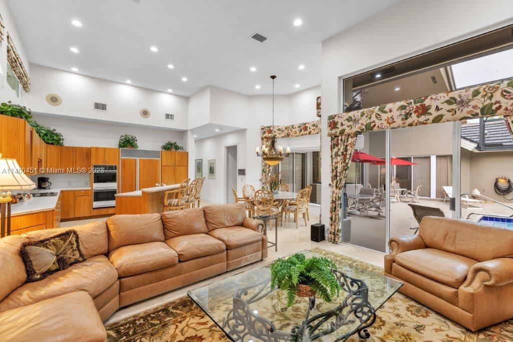 7236 Queenferry Circle Boca Raton, FL 33496 - Photo 22 of 31 a living room with furniture kitchen view and a large window