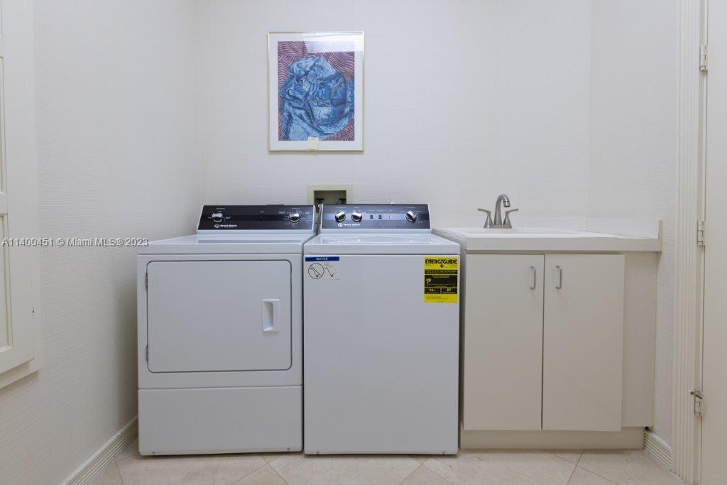 7236 Queenferry Circle Boca Raton, FL 33496 - Photo 25 of 31 a utility room with dryer and washer