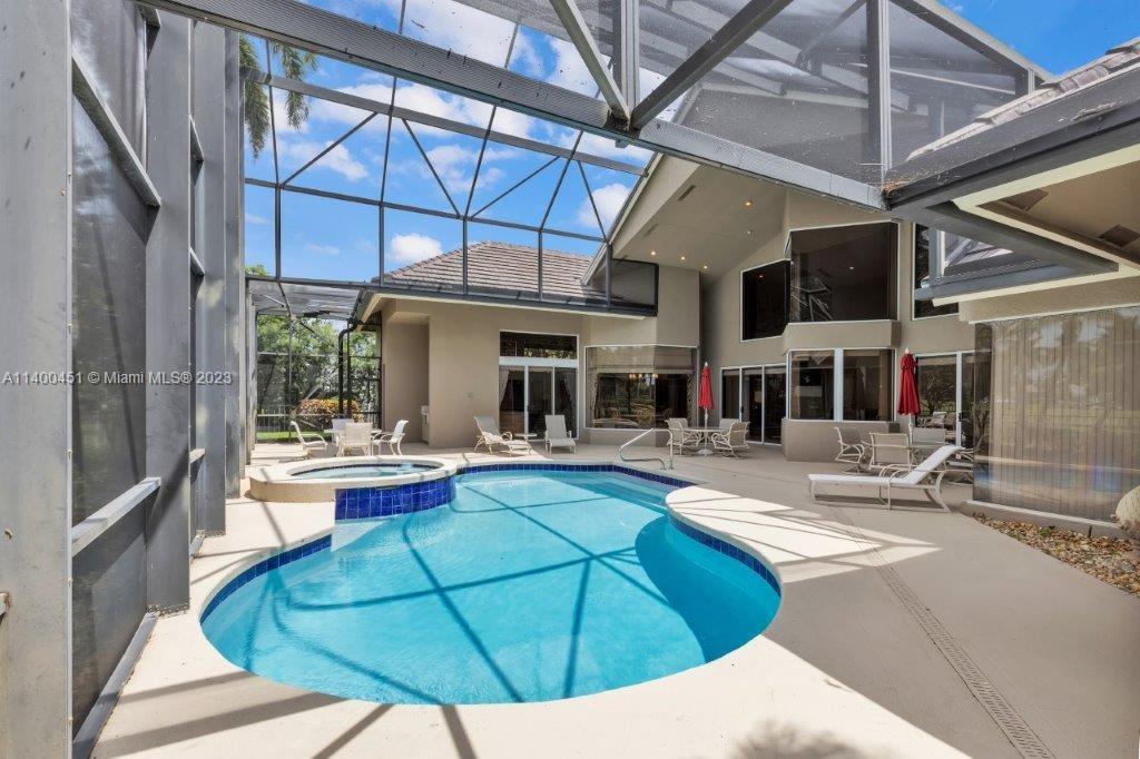 7236 Queenferry Circle Boca Raton, FL 33496 - Photo 28 of 31 a view of a house with backyard porch and sitting area