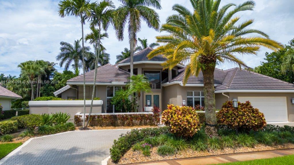 7236 Queenferry Circle Boca Raton, FL 33496 - Photo 3 of 31 a front view of a house with a garden