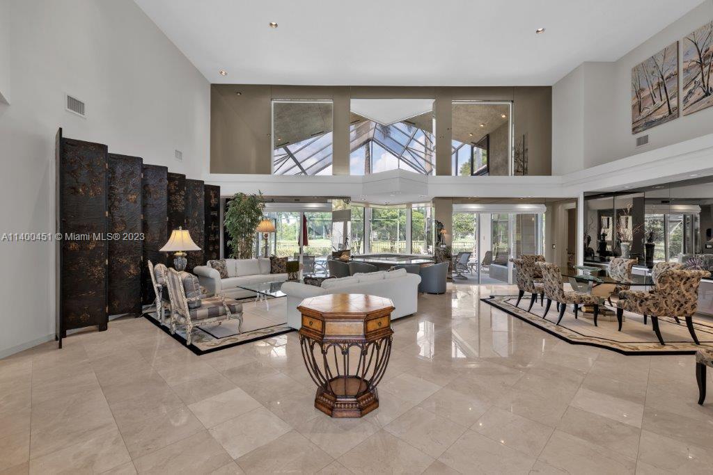 7236 Queenferry Circle Boca Raton, FL 33496 - Photo 5 of 31 a living room with fireplace furniture and a large window