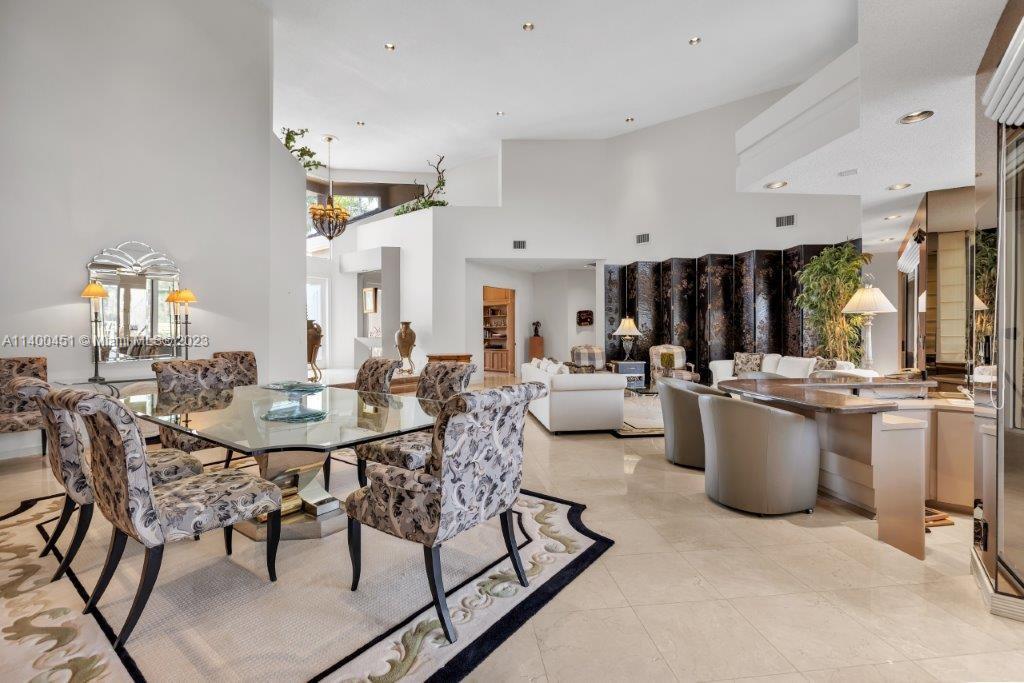 7236 Queenferry Circle Boca Raton, FL 33496 - Photo 8 of 31 a view of a dining room with furniture and chandelier