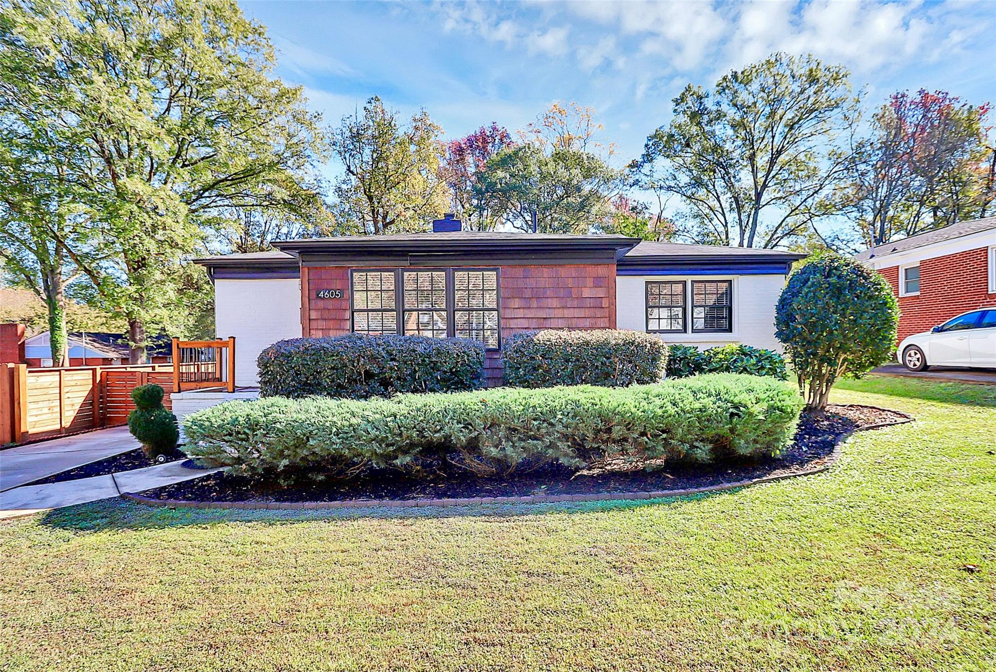 4605 General Pershing Drive Charlotte, NC 28209 - Photo 1 of 35 a front view of a house with a yard and potted plants