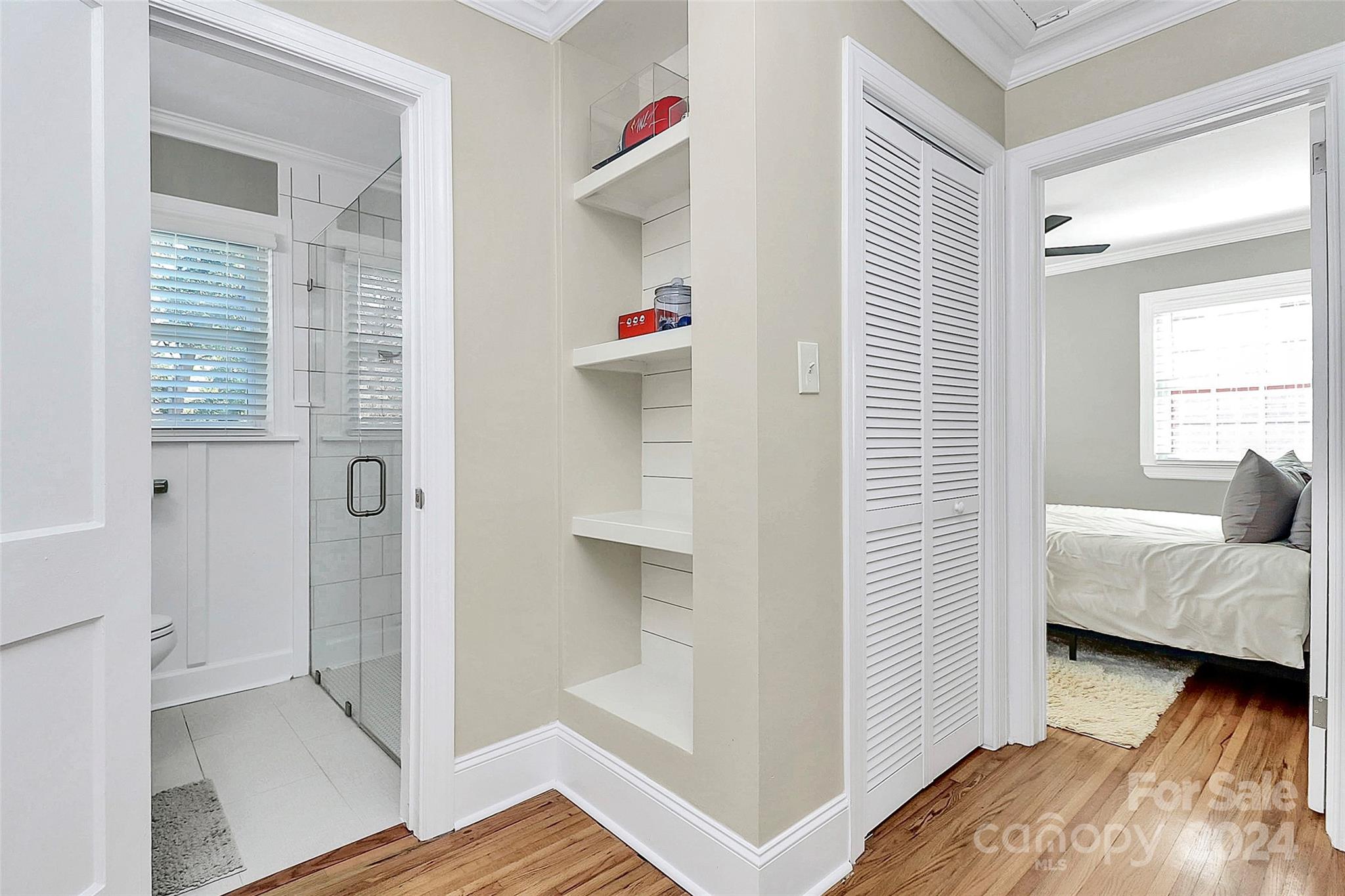 4605 General Pershing Drive Charlotte, NC 28209 - Photo 12 of 35 a bedroom with a bed and wooden floor