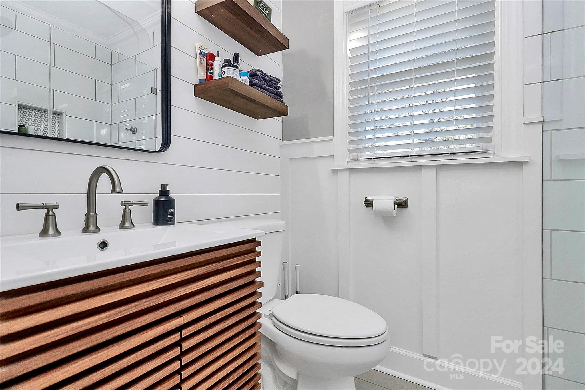 4605 General Pershing Drive Charlotte, NC 28209 - Photo 17 of 35 a bathroom with a sink and a toilet