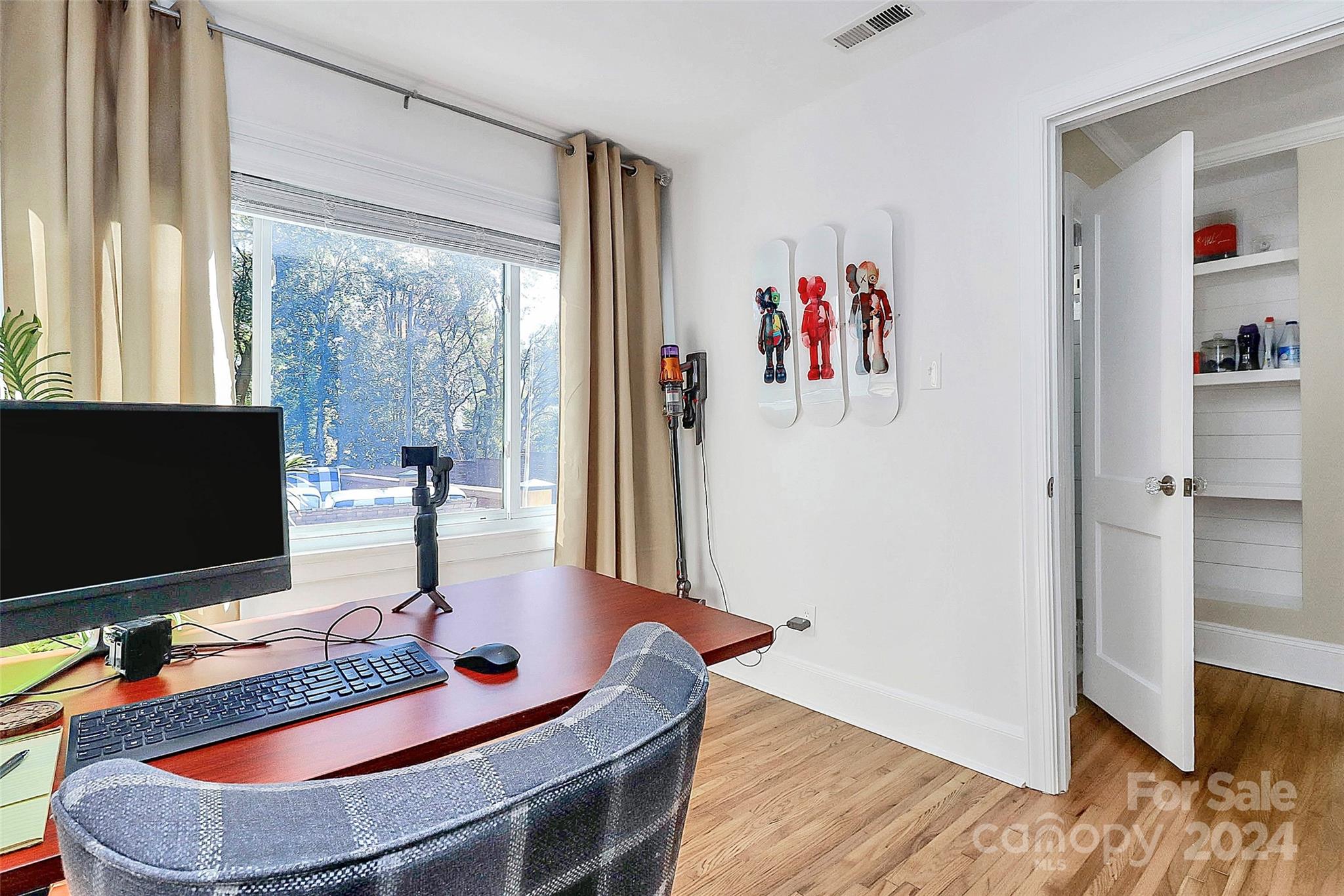 4605 General Pershing Drive Charlotte, NC 28209 - Photo 23 of 35 a room with furniture and a flat screen tv