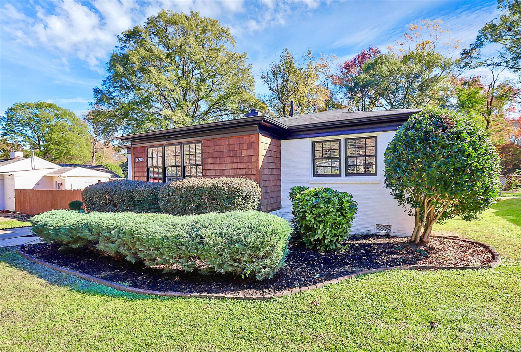 4605 General Pershing Drive Charlotte, NC 28209 - Photo 31 of 35 a view of a house with a yard and potted plants