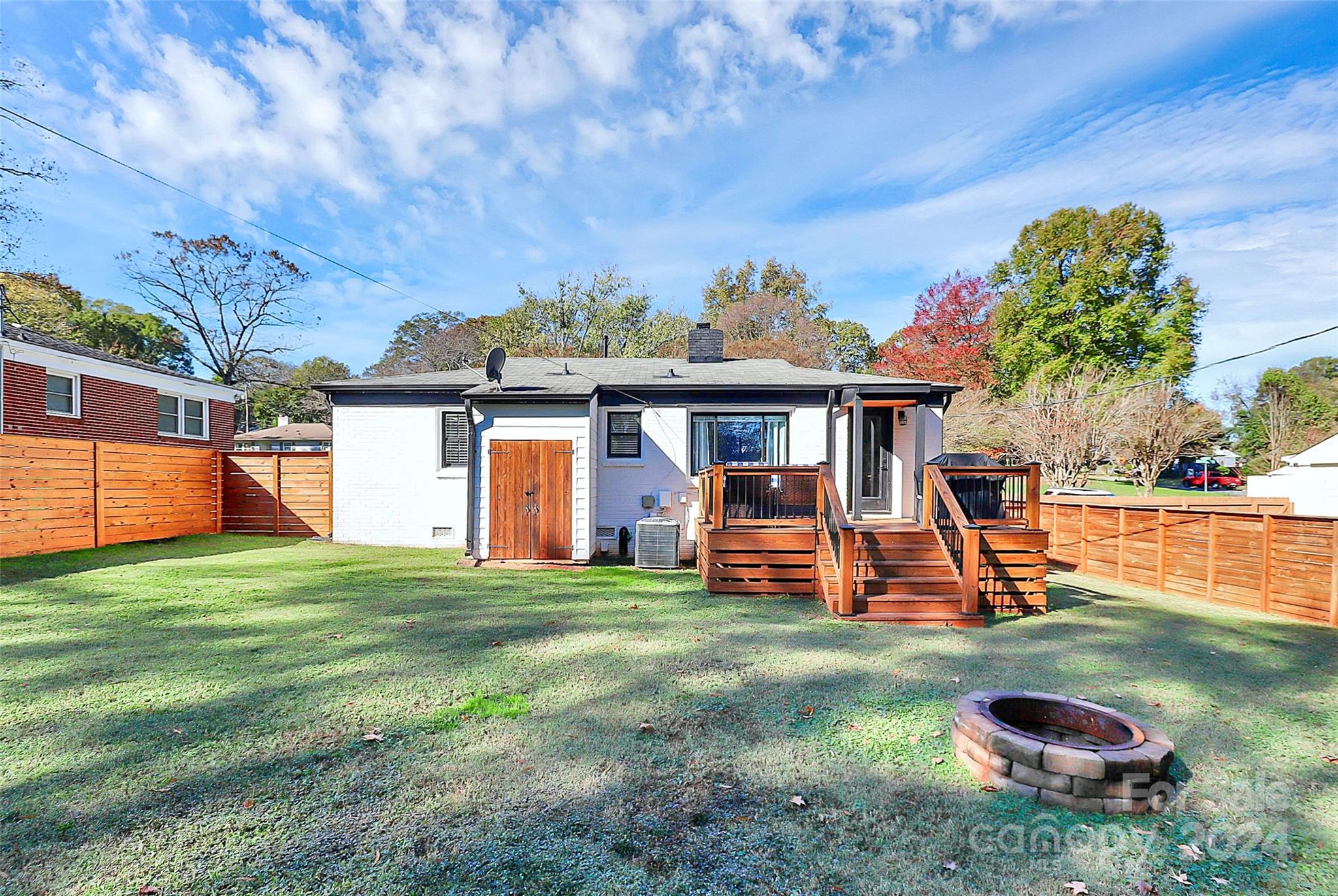 4605 General Pershing Drive Charlotte, NC 28209 - Photo 32 of 35 a view of a house with backyard porch and sitting area