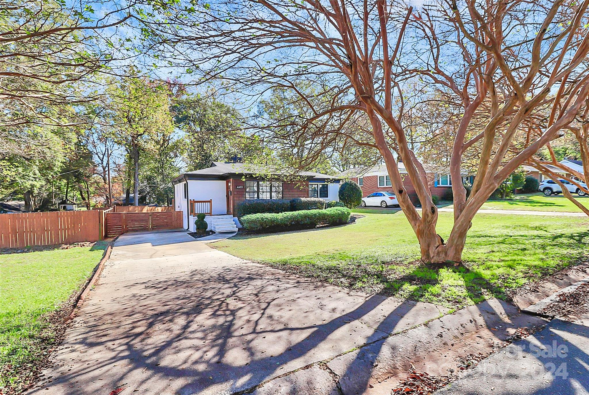 4605 General Pershing Drive Charlotte, NC 28209 - Photo 34 of 35 a front view of a house with a yard and trees