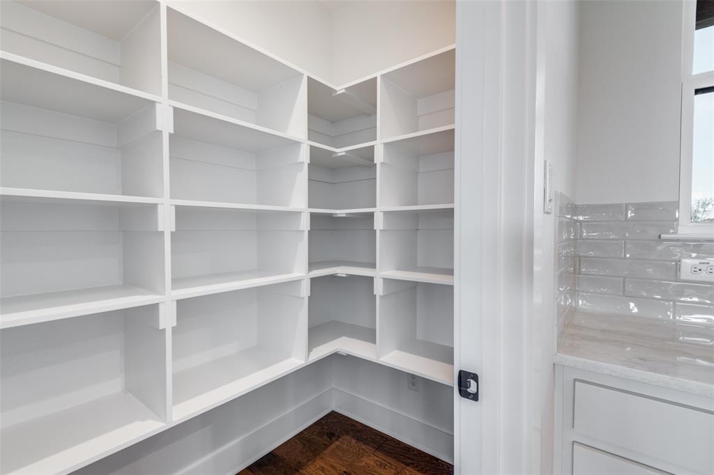 820 Evergreen Way Nevada, TX 75173 - Photo 27 of 37 a view of walk in closet with empty racks